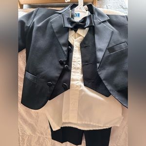Size 2t 5 piece tux… jacket, vest, pants, long sleeve shirt and a bow tie.